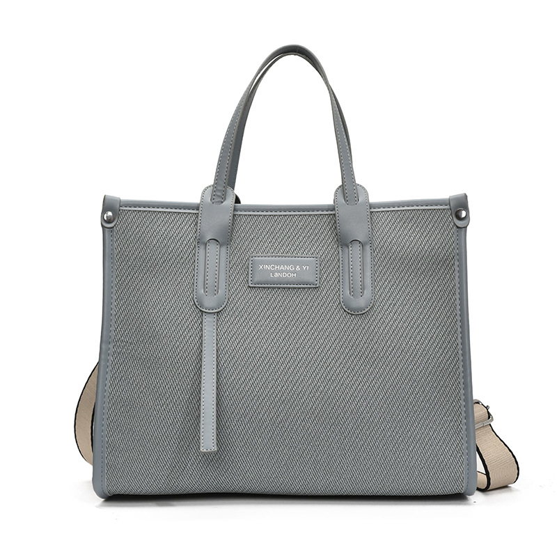 Bolso de gran capacidad para mujer 2025 verano nuevo estilo moda contraste color costura mensajero bolso simple de viaje