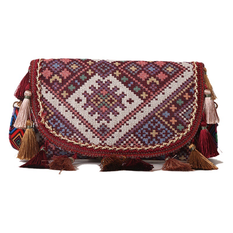 Nueva moda estilo étnico estudiante bolso de gran capacidad bolso de mano de las mujeres de estilo occidental borla bolso de hombro de las mujeres al por mayor