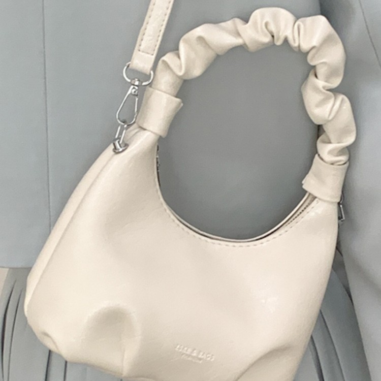 2026 primavera nueva moda temperamento bolso de hombro de moda bolso de arco de moda moda bolso de mano de tendencia diaria plegado mochila
