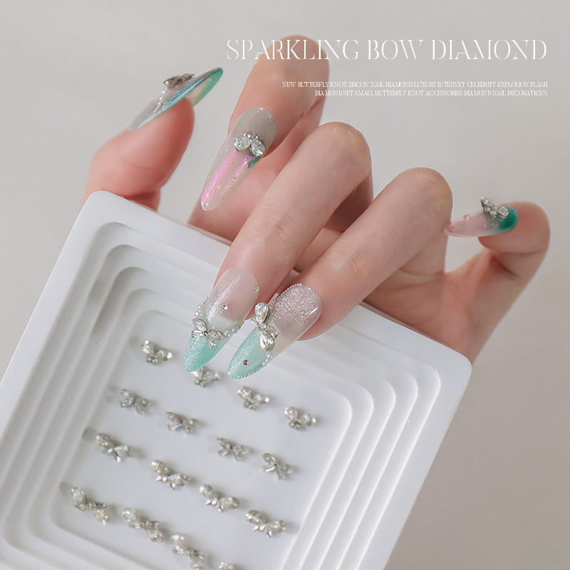 Nuevo estilo bowknot circón manicura de diamantes de lujo celebridades de Internet destellantes pequeños accesorios de lazo joyas de uñas de diamantes al por mayor