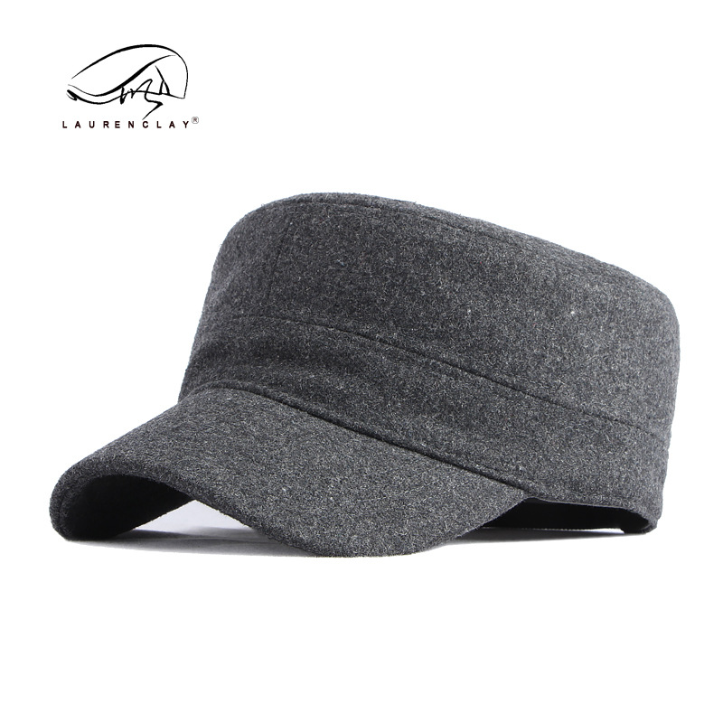 Sombrero al por mayor de los hombres otoño y el invierno lana caliente sellado completo casquillo enarbolado simple luz tablero superior plana azul marino sombrero