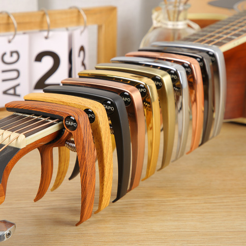 Guitar capo zinc alloy folk capo ukulele metal classical pull-out fixed string cone string nail accessories