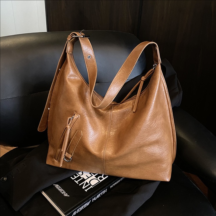 Bolsa de viaje retro de alta calidad para mujeres 2025 invierno nuevo estilo de moda multifuncional bolso de hombro de textura de moda bolso de brazo