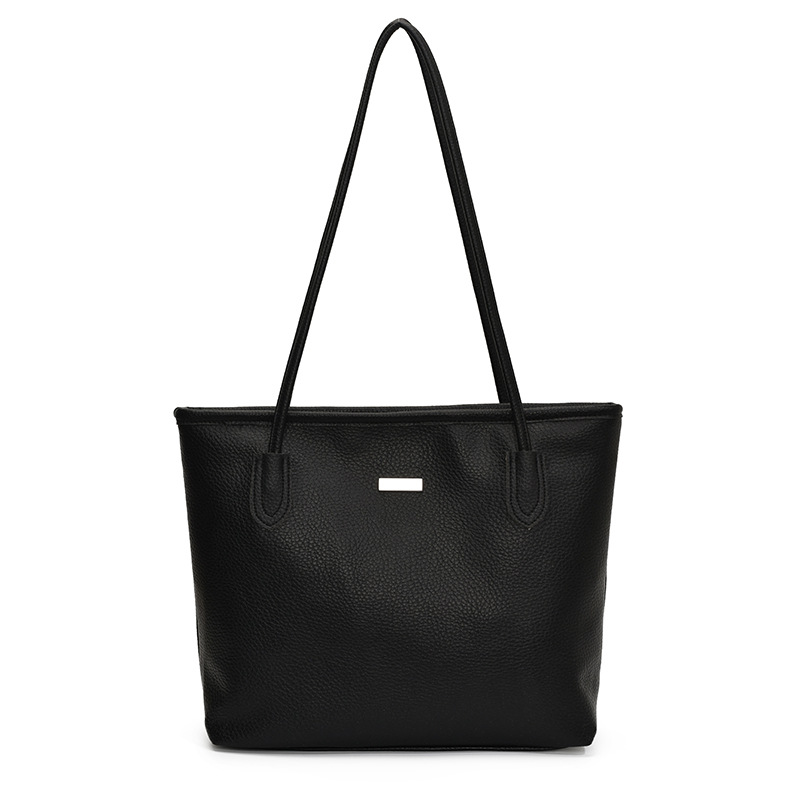 Nuevo bolso de gran capacidad de primavera en 2025 Bolso de hombro de color sólido casual popular de este año Bolso de mujer Tote de axila de estilo occidental