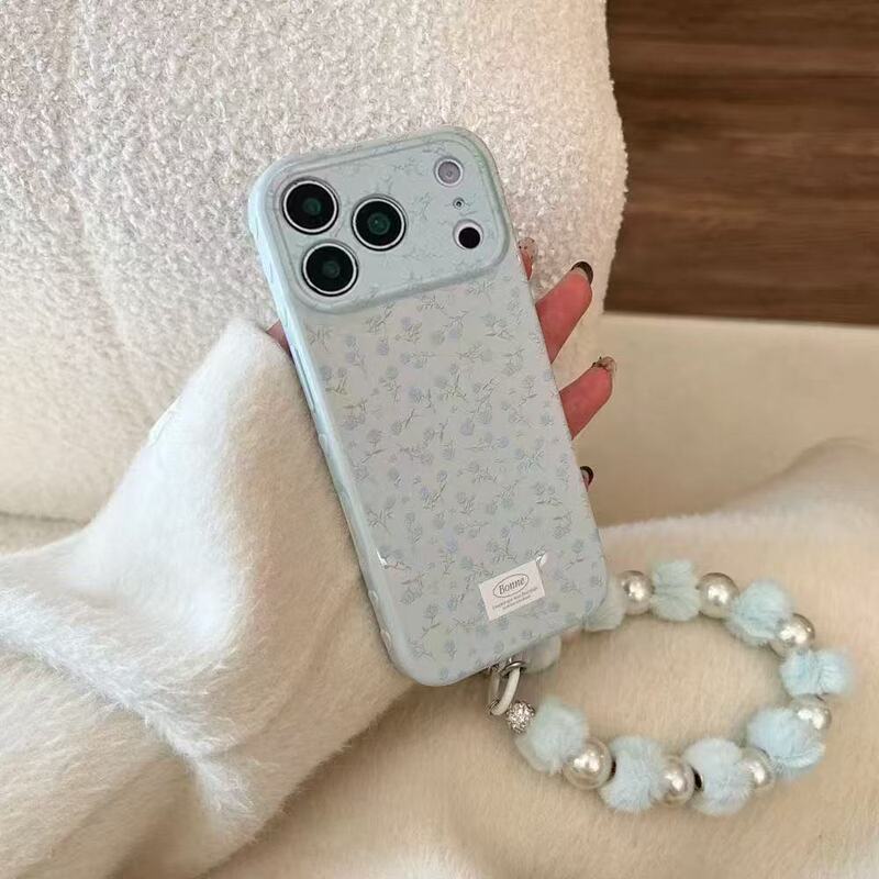 Instagram-worthy blue floral iPhone 17 Pro Max case with side heart design and lanyard for 16 Pro/15/14