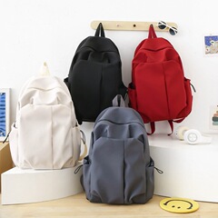 オリジナルデザインのシンプルな純色のコンピュータのリュックサック大学の高校のカバンの森系キャンパスのキャンバスのリュックサックの男女