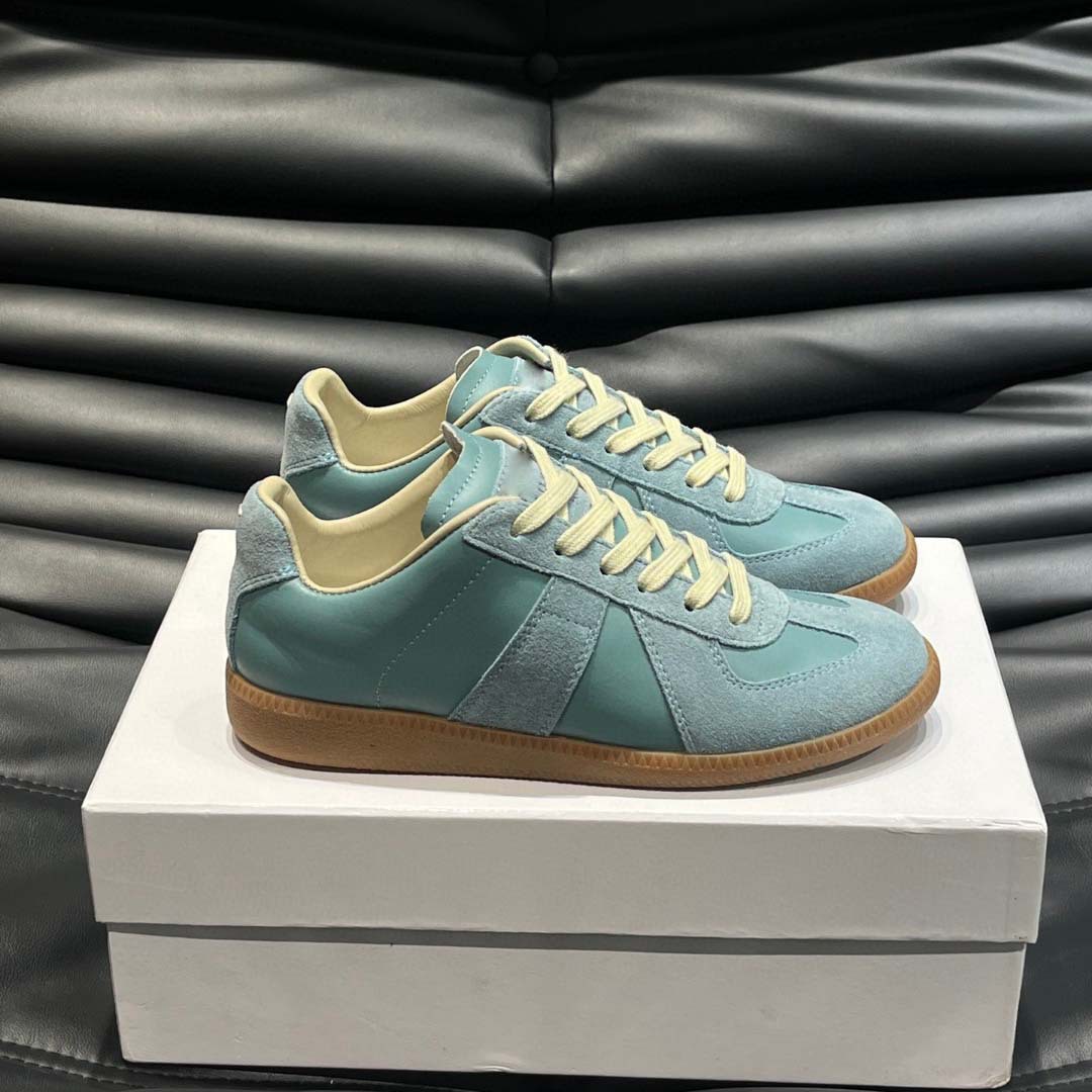 Estación europea 2025 nuevos zapatos de entrenamiento alemanes para hombres y mujeres zapatos planos casuales de todo fósforo zapatos de pareja con cordones de cuero zapatillas de deporte