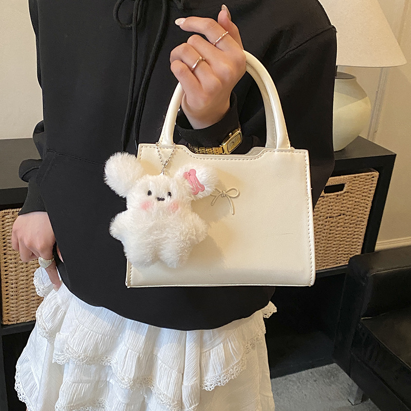 Bolsos coreanos para niños y niñas, lindos colgantes de peluche, bolsos de mano para bebés, bolsos mini para niños.