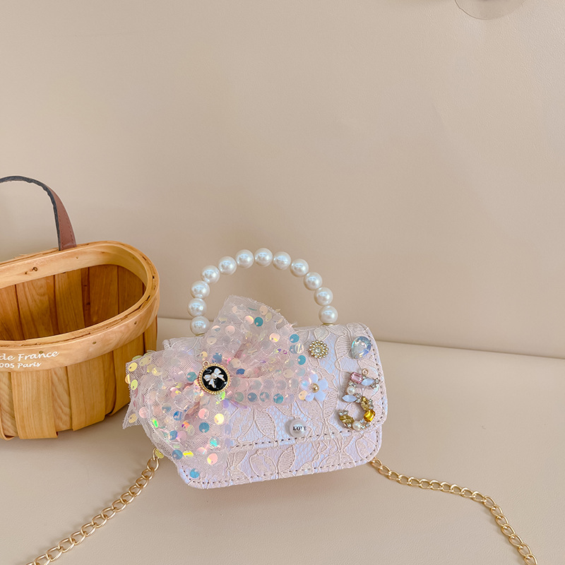 Primavera y verano nueva celebridad en línea bolso de los niños moda Chanel estilo princesa bolsa pequeña niña linda bolsa de mensajero portátil al por mayor