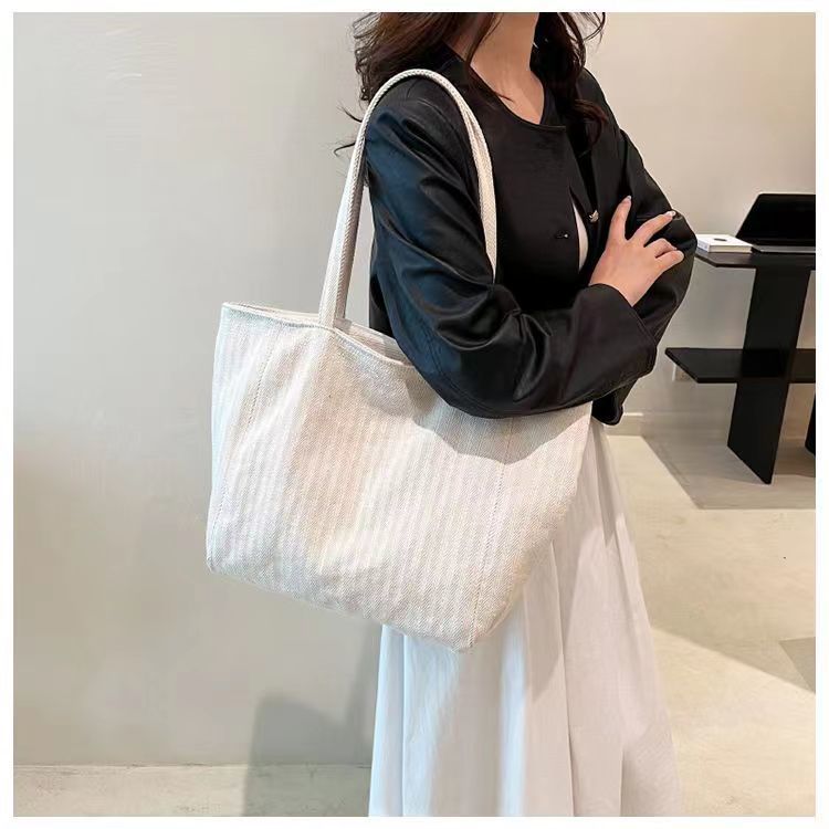 Pequeña bolsa de lona a rayas frescas de hombro para mujeres, bolsas escolares de clase de gran capacidad, bolsas de compras japonesas y coreanas, bolsas especiales.