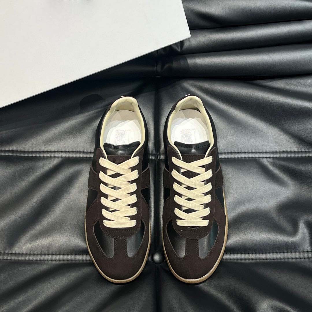 Estación europea 2025 nuevos zapatos de entrenamiento alemanes para hombres y mujeres zapatos planos casuales de todo fósforo zapatos de pareja con cordones de cuero zapatillas de deporte