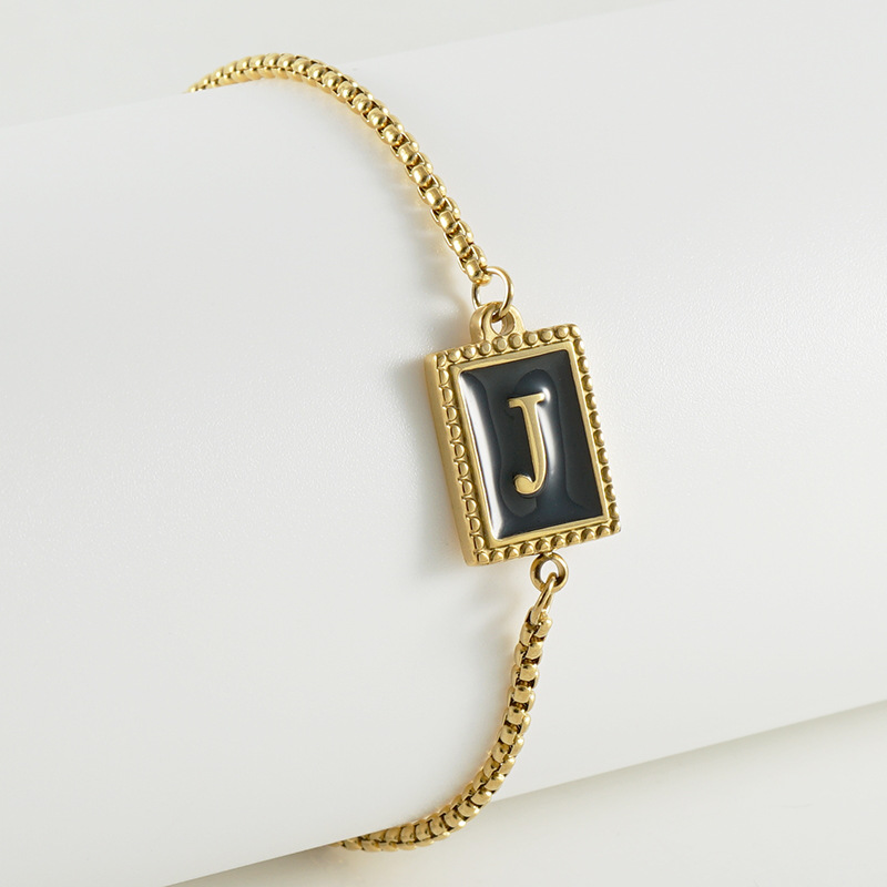 La moda europea y americana transfronteriza del acero inoxidable 26 pulsera inglesa de la letra en relieve pulsera Titanium de la cremallera del acero 18K de la frontera para las mujeres