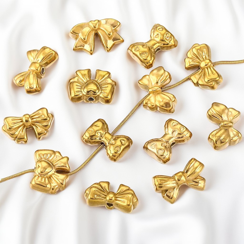 Acero inoxidable transfronterizo agujero recto fundición arco DIY material perlas pendientes para el cabello collar impermeable joyas chapadas en oro