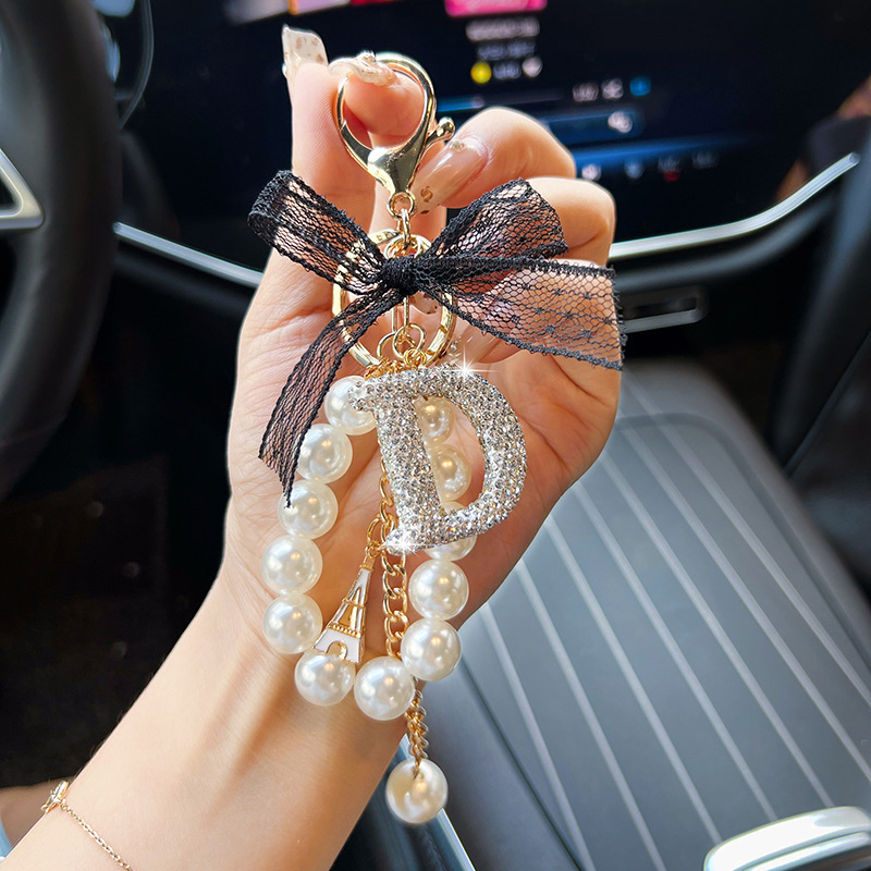 Arco de encaje de cerámica de arcilla letras llavero de perlas creativo colgante de llaves de automóvil de diamante completo colgante de bolsa