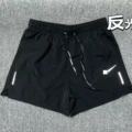 Black shorts with reflective hook and loop design