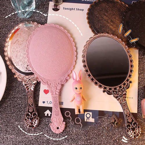 Retro handheld makeup mirror with European floral edge handle mirror hole design, high-definition mirror surface small mirror