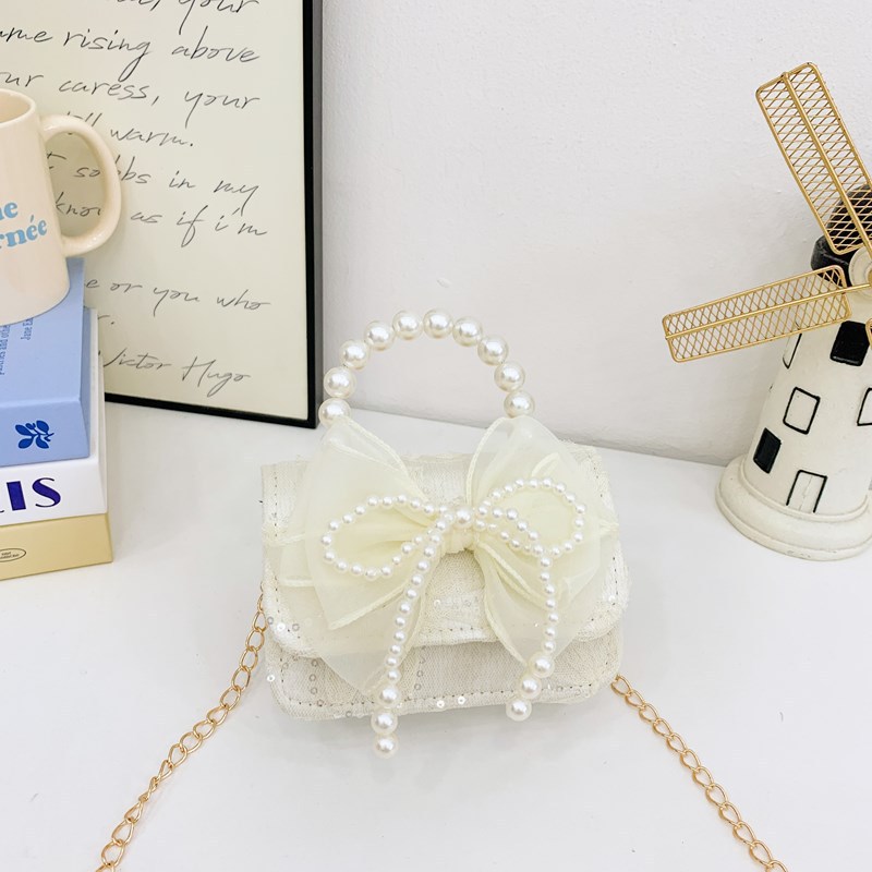Nueva princesa flor de encaje niñas mochila de hombro de moda perla arco bolso de niños bolso de cambio de dibujos animados