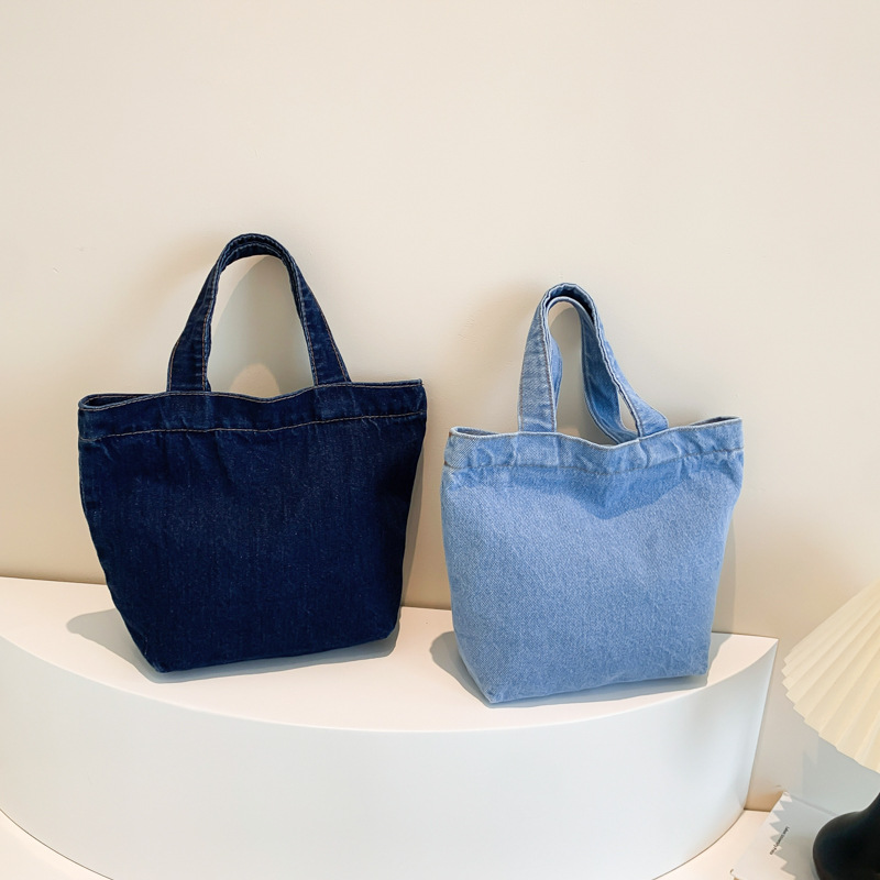 Regalos al por mayor de bolsos vaqueros, tendencias de moda simples, bolsos literarios y artísticos de gran capacidad, versión coreana de bolsos de lona de desplazamiento de estilo extranjero