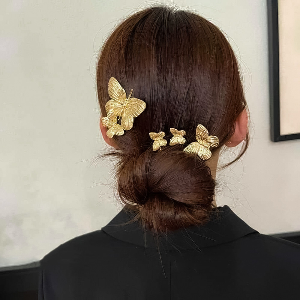 Horquilla de mariposa de metal retro francés elegante temperamento de nicho flequillo de cabello roto clip lateral de lujo ligero joyería de alta gama