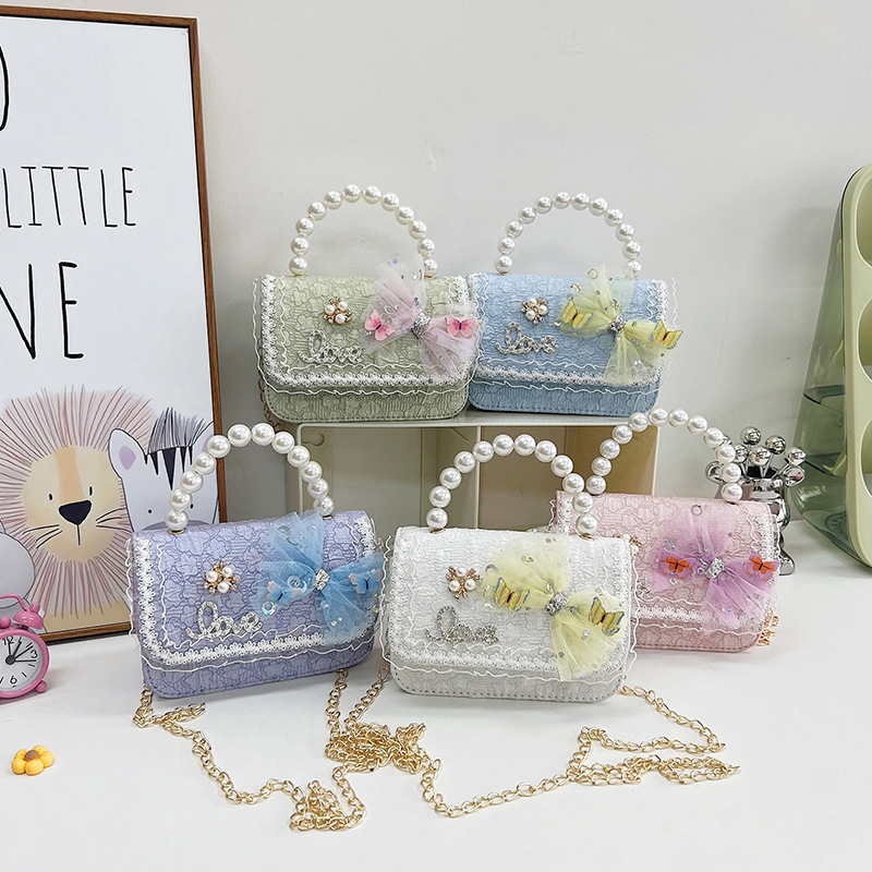 2023 nuevos niños bolsa de mensajero bolsa de moda princesa arco bolso de hombro coreano mini bolso de la cadena de la muchacha