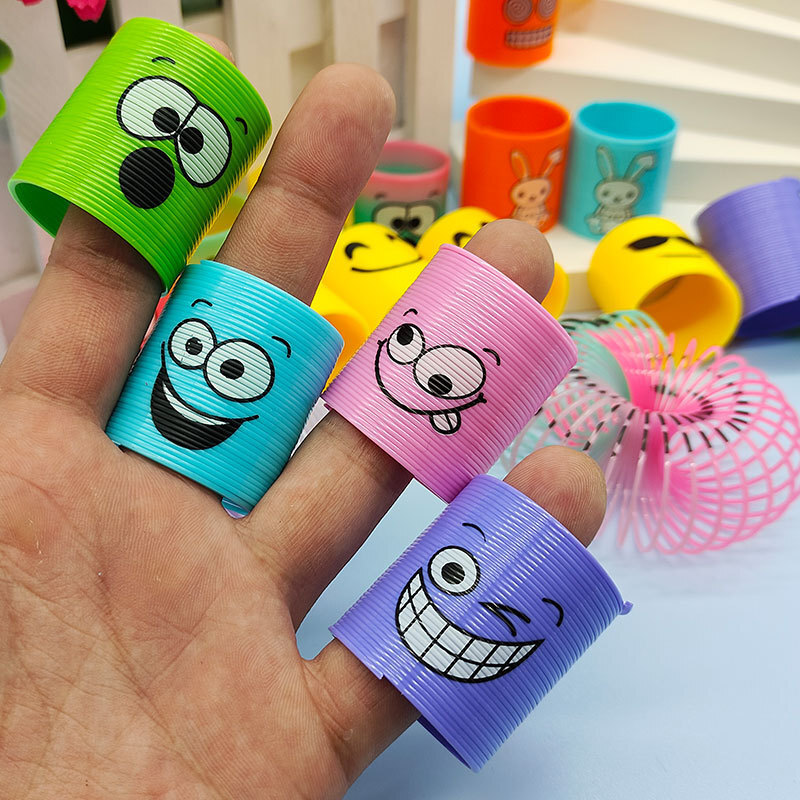 Regalo de trompeta de anillo de primavera de venta caliente transfronteriza, rompecabezas, nostalgia, sonrisas sonrientes apiladas, música mágica círculo del arco iris
