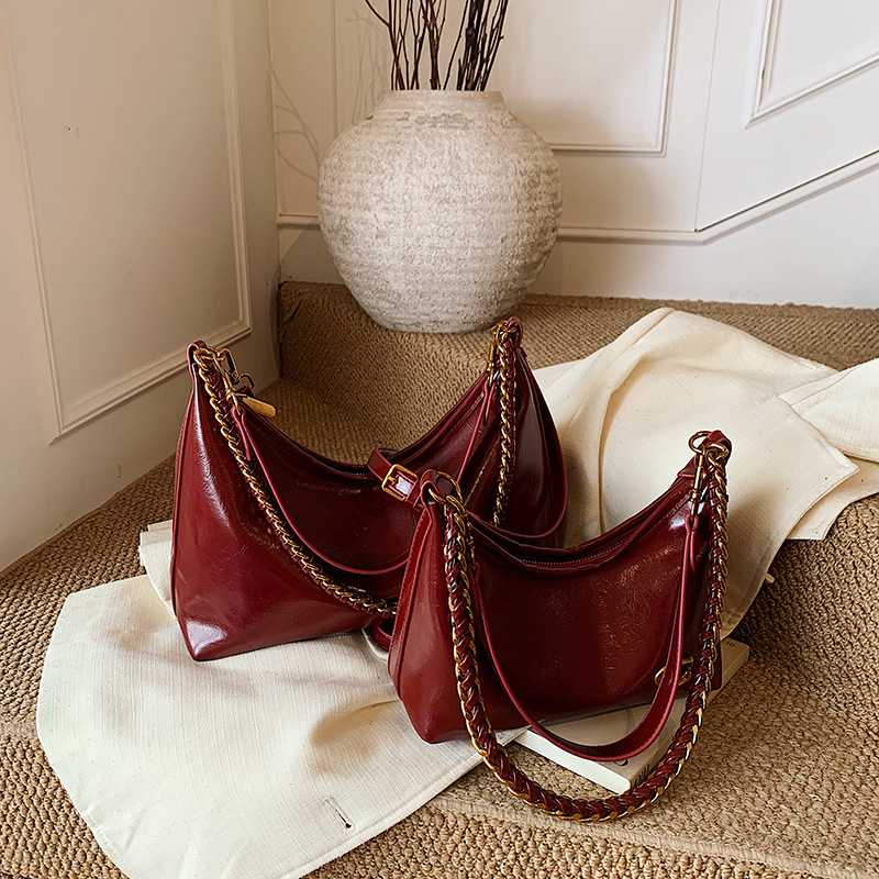 Bolso de alta sensación de mujer 2025 nuevo nicho de cadena brazaleta bolso súper caliente universal bolso de hombro