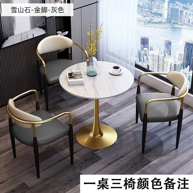 Gold legs + white rock slab table with three chairs [color to be specified]