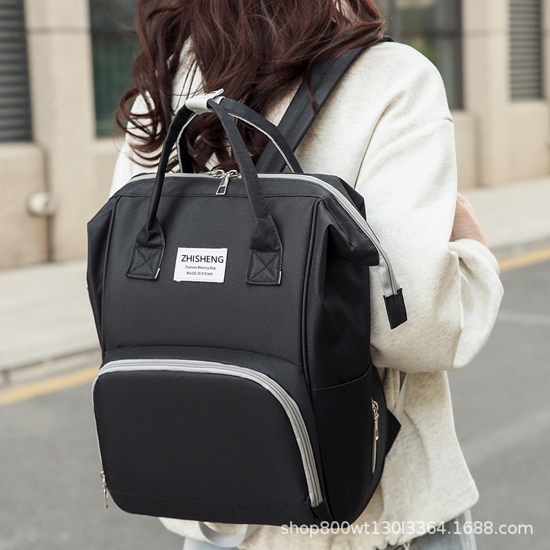 Transfronterizo nuevo bolso de mamá multifuncional portátil de mano ligero bolso de hombro madre-bebé de gran capacidad madre fuera mochila al por mayor