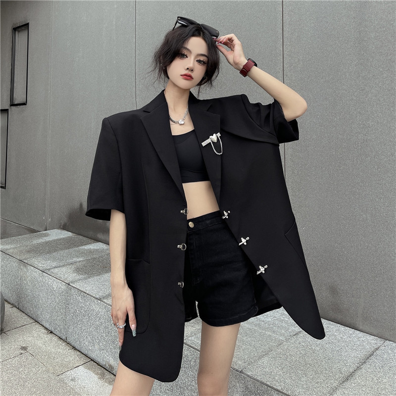 Real Shot of a Women's Thin, Loose-Fitting Short-Sleeve Blazer with a Faux Two-Piece Design and Metal Buttons on the Back