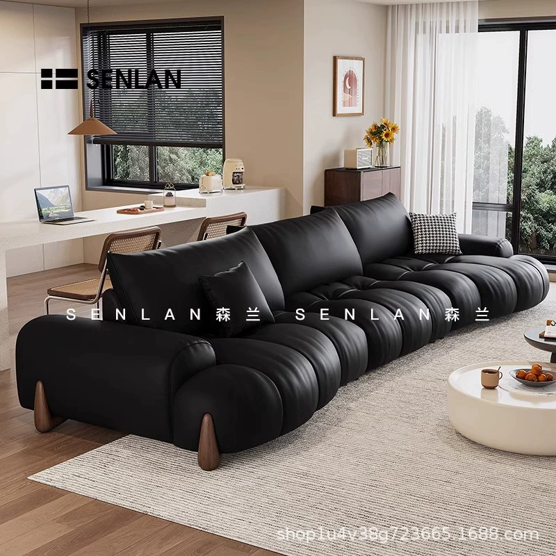 Адидас тщательно выбрал кожаный диван в стиле ретро для гостиной. Итальянский минималистский диван для небольшой квартиры специальной формы, большой сидячий глубоко изогнутый кожаный художественный диван.