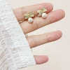 Mosquito coil with zircon pearl with bow, ear clips