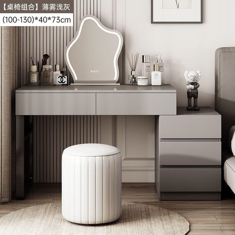 Wardrobe de madera maciza de tabla de roca dormitorio moderno simple pequeño tipo de lujo ligero de alta sensación armario de maquillaje en casa