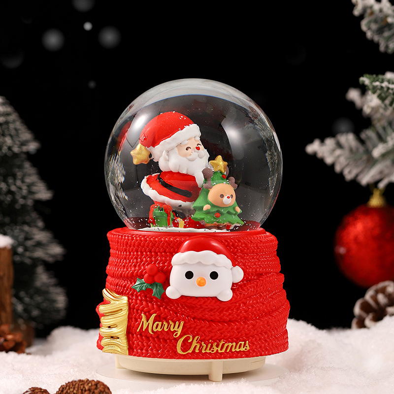 Una variedad de regalos de decoración de Navidad Navidad iluminante bola de cristal caja de música ventana diseño de velas lámparas de viento árbol de Navidad