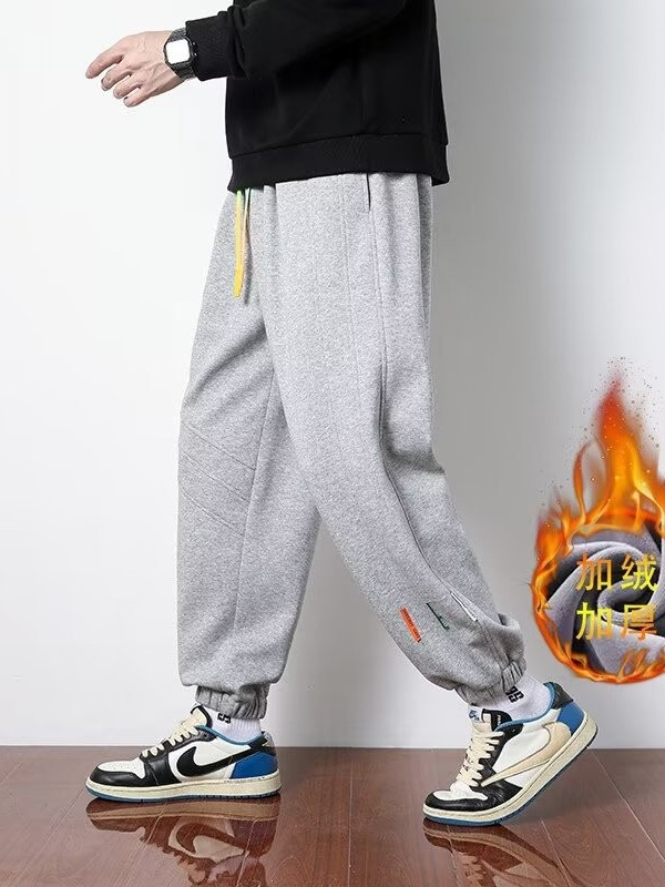 Primavera y otoño 2024 nuevos pantalones casuales para hombres, pantalones deportivos sueltos de la marca de moda juvenil, pantalones deportivos sueltos de color sólido