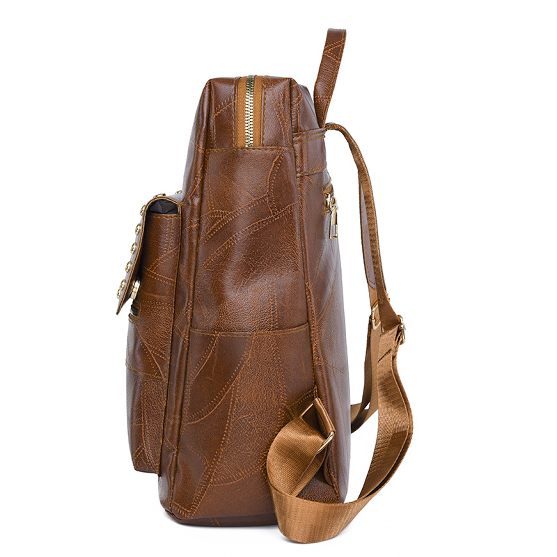 Mochila de cuero suave para mujer casual de nuevo estilo transfronterizo, moda, lujo ligero, viajero urbano, color de contraste, mochila de viaje, marea al por mayor