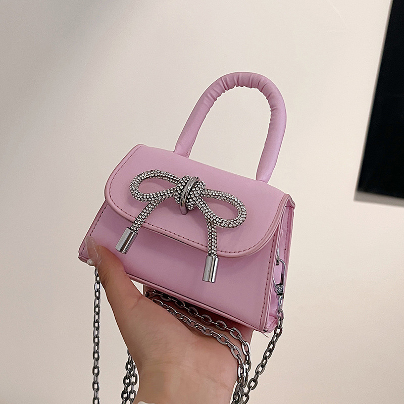 Moda al por mayor arco mini bolso mujer 2025 nuevo mochila bolso de hombro universal bolso de moda mujer