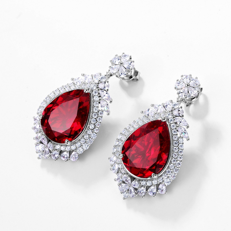 2023 nuevos pendientes de plata S925 pendientes de corindón rojo y azul lujo noble temperamento estilo europeo y americano en el pelo de la generación de stock