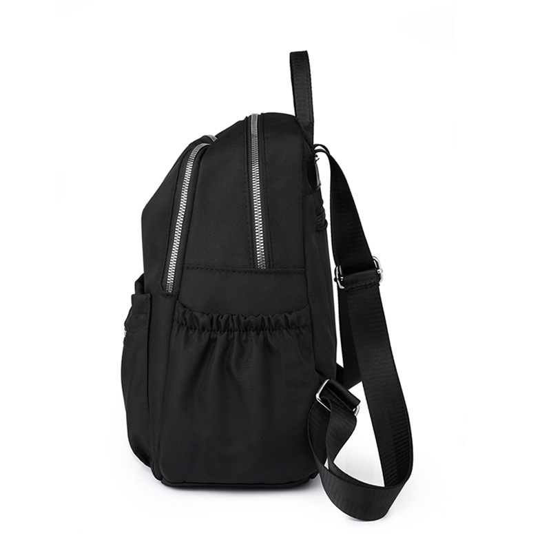 2023 otoño nuevo estilo casual damas mochila de nailon simple color sólido al aire libre mochila de viaje ligera mochila escolar