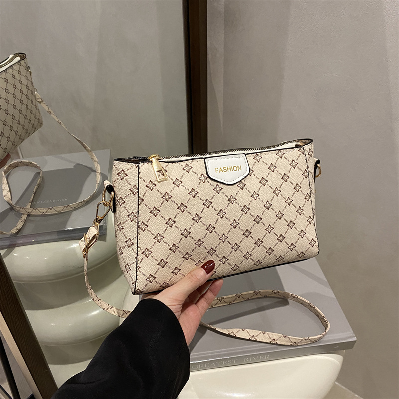 Bolso de hombro para mujer a juego diario 2025 verano nuevo estilo PU moda europea y americana impresión retro letras bolso de mensajero