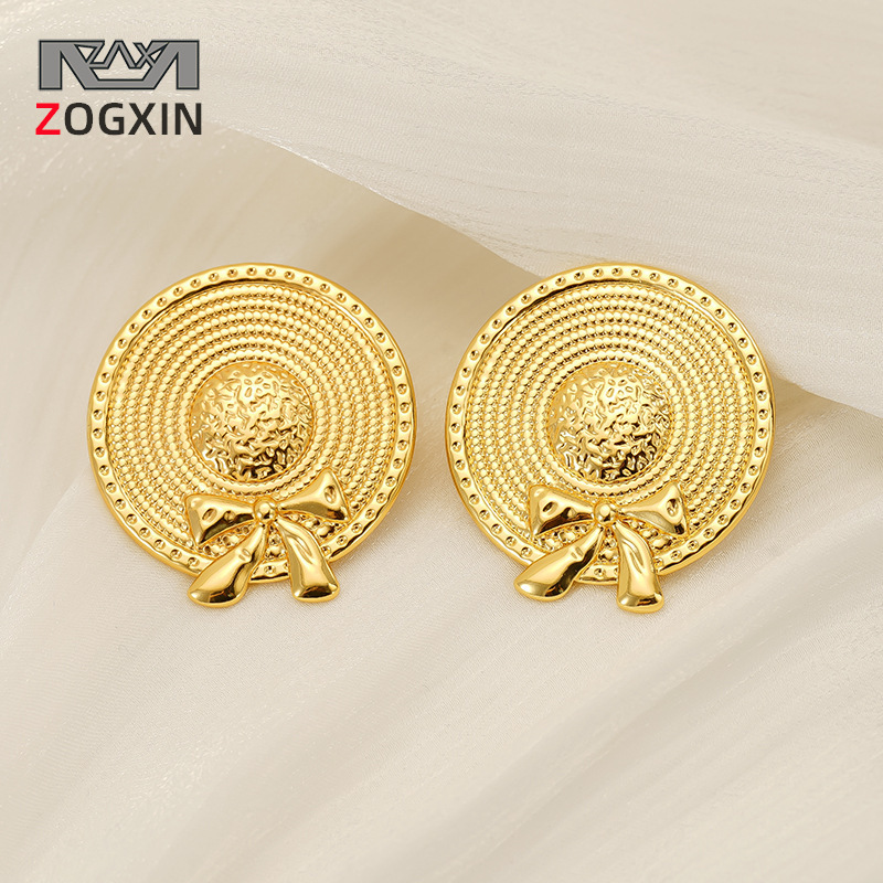 Pendientes de sombrero de paja con lazo de acero inoxidable nuevo transfronterizo europeo y americano Pendientes de acero de titanio dorado de moda de estilo INS femenino
