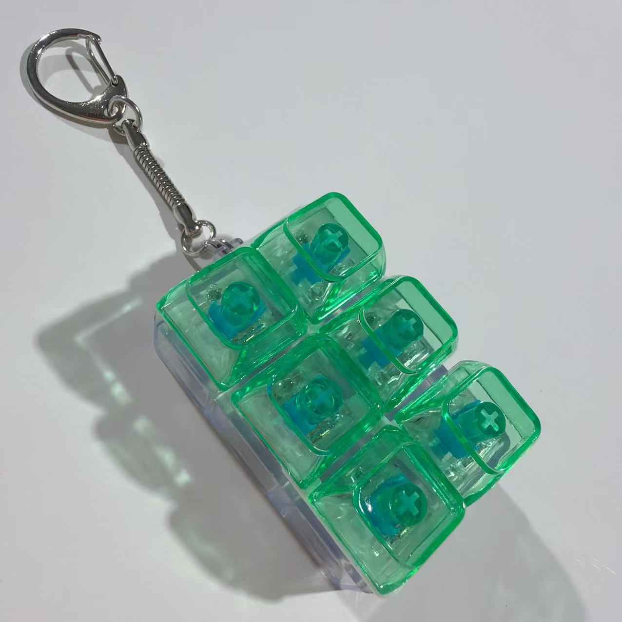 Double row six buttons-transparent shell-green transparent cap