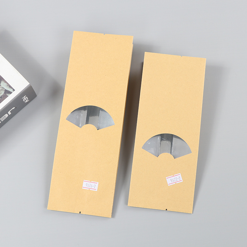 Spot bolsa de papel kraft con ventana transparente bolsa de embalaje de alimentos autosellada autoportante bolsa de té sellada de ocho lados fácil de rasgar