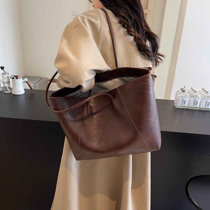 Bolsa de mano transfronteriza de gran capacidad para mujeres 2025 nueva bolsa de brazo portátil de viaje de alta calidad bolso de hombro casual