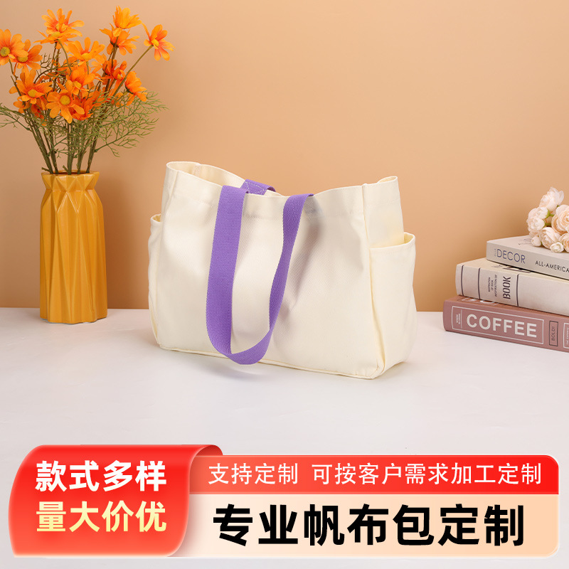 都市简约大容量多层收纳帆布包支持多种附加工艺日常出行实用包袋