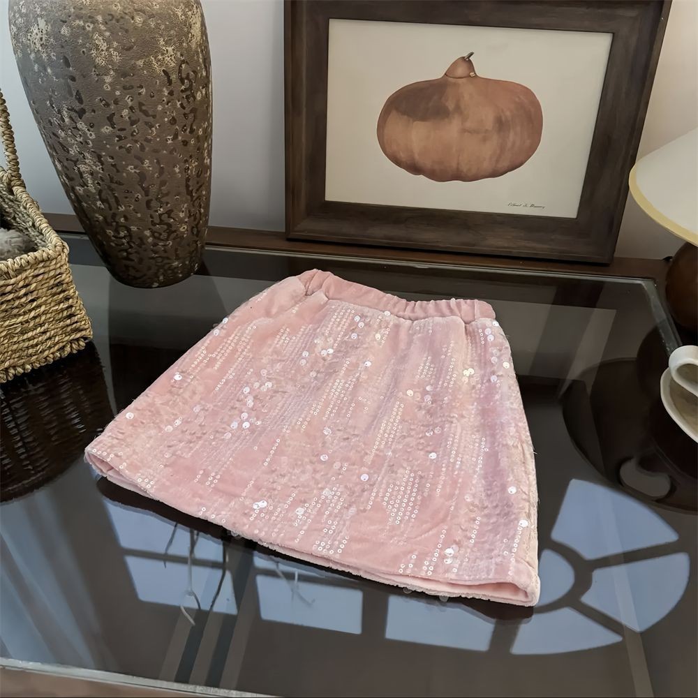 Niños estrella redonda falda de niña 2024 otoño y invierno ropa coreana de color sólido extranjero falda de cinturón para bebés con una falda corta gruesa de lana