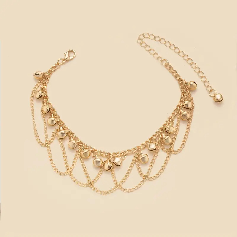 Cavigliera con nappe e campanellini in stile bohémien, accessorio moda da spiaggia colorato e di tendenza per donna._voghion.com