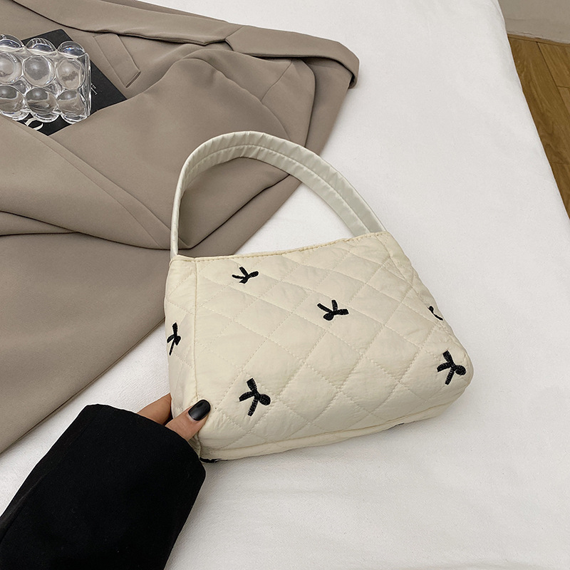 2024 nuevo bolso de arco de bordado, bolsa de maquillaje de gran capacidad, bolsa de lavado, bolsa de ocio, bolsa de mujer