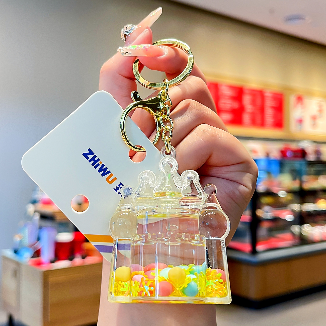 Nuevo aceite de arenas movedizas llavero lindo deriva botella de arenas movedizas colgante coche de dibujos animados llavero pequeño regalo al por mayor