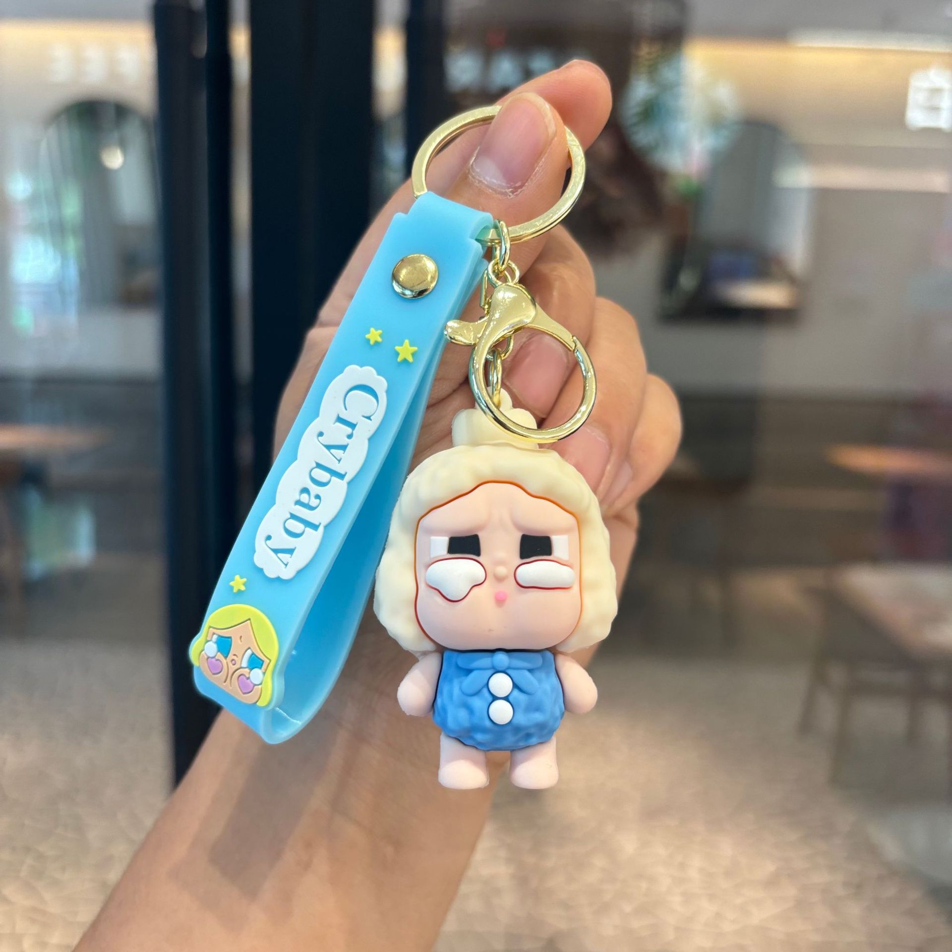 Lágrimas muñecas de dibujos animados llavero lindo bebé llorando muñeca mochila escolar para niños colgante llavero máquina de muñecas regalo