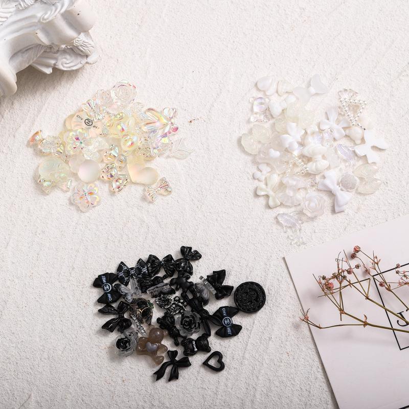 Cross-border nail Bow accesorios Diamond 100 mezcla de resina hecha a mano Rosa tridimensional negro blanco Aurora